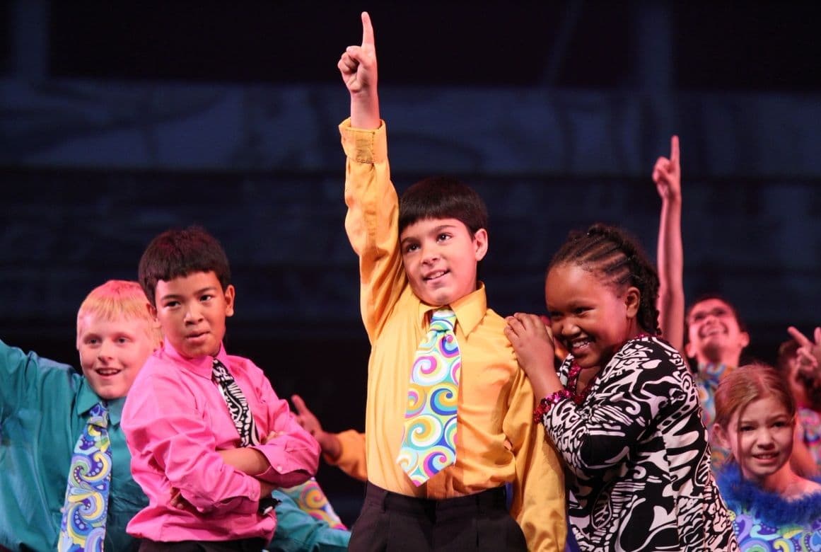 Alum Sam Brill at NDI on stage in 2012