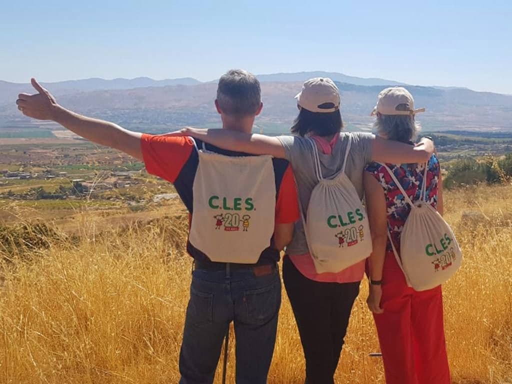 Three people looking at a view
