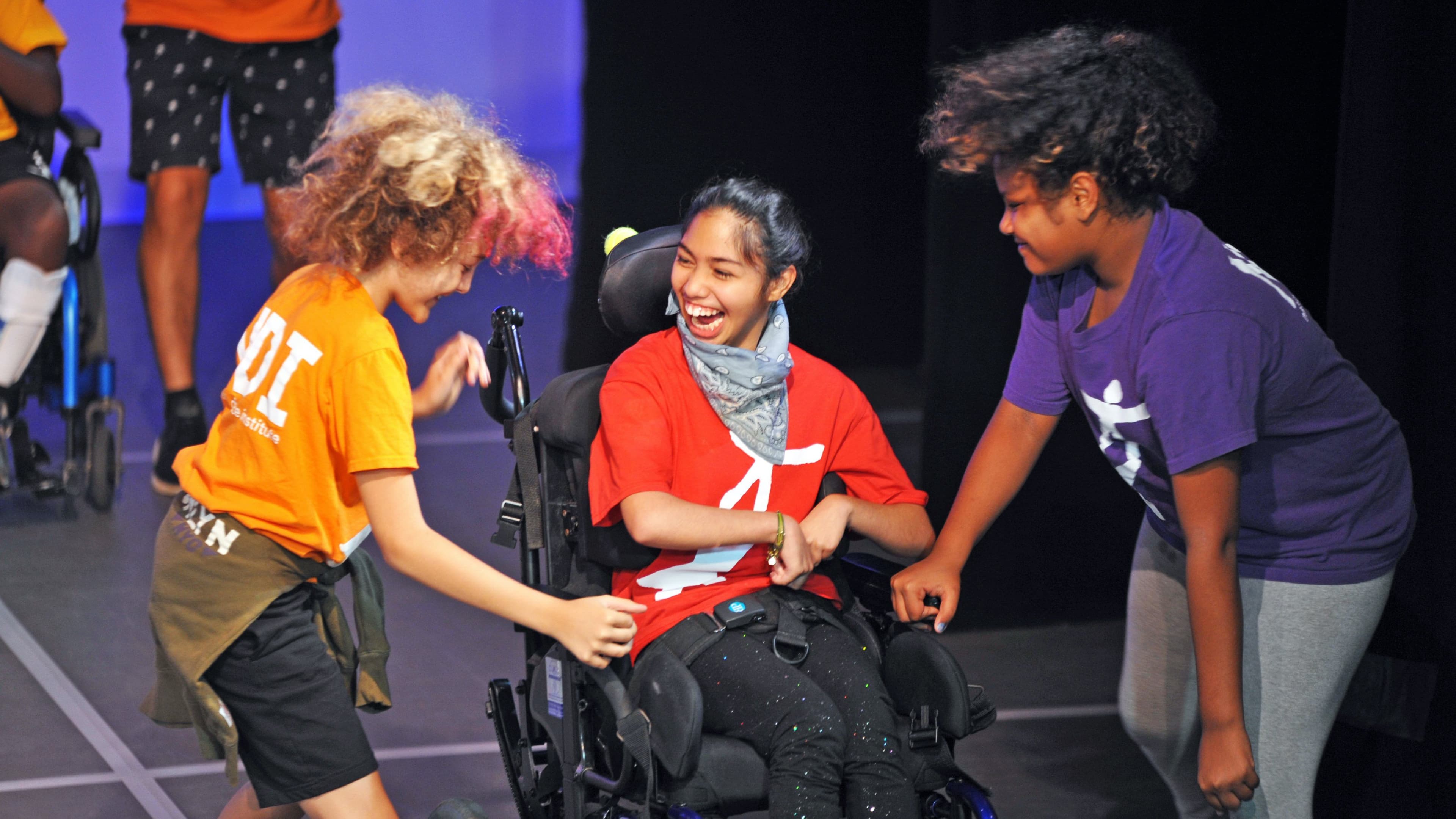 Girl smiling in a wheelchair