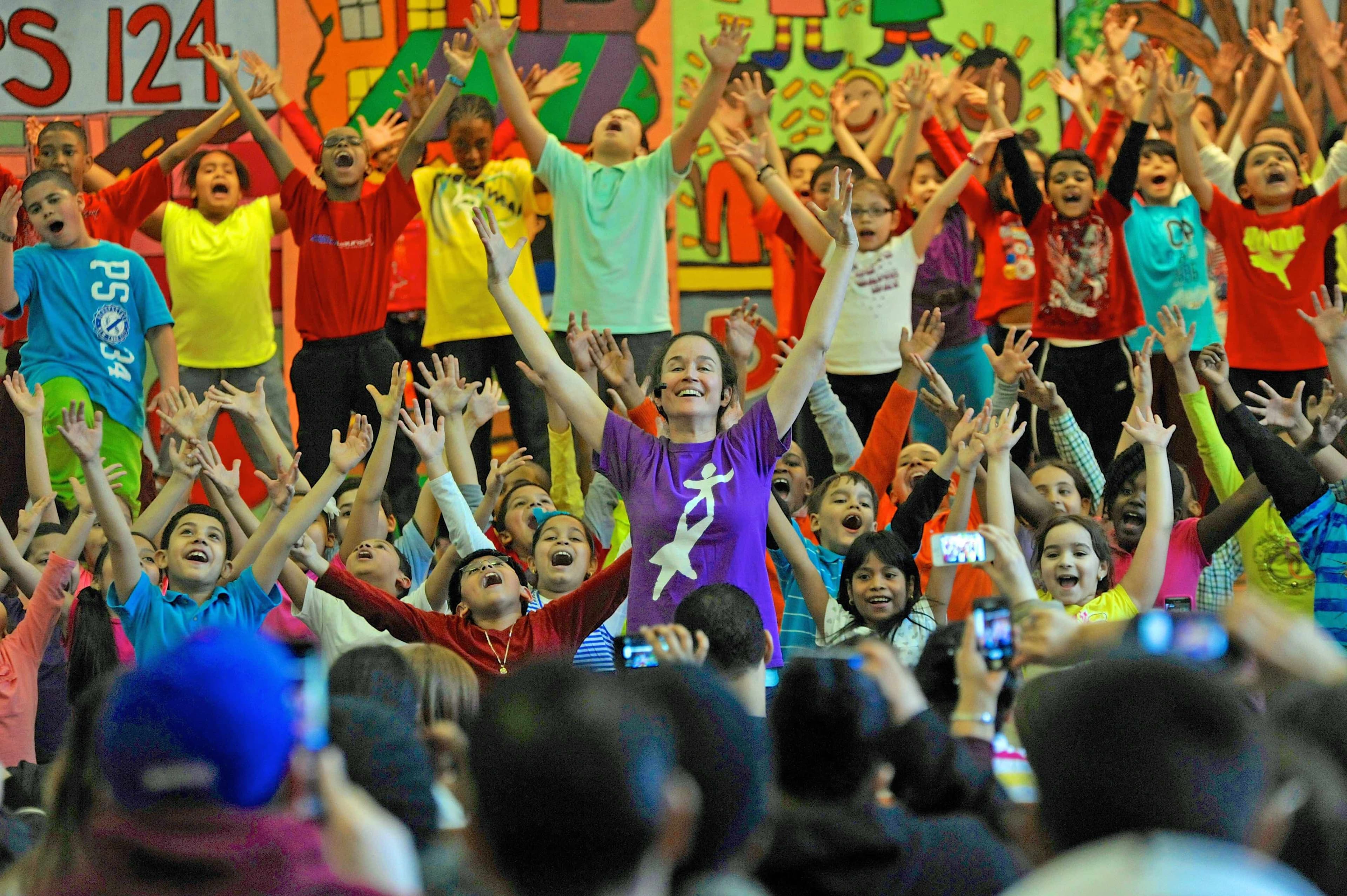 Mary Kennedy teaching a crowd of kids