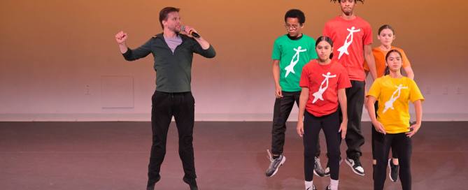 Energetic dance performance by diverse youth at National Dance Institute showcase.