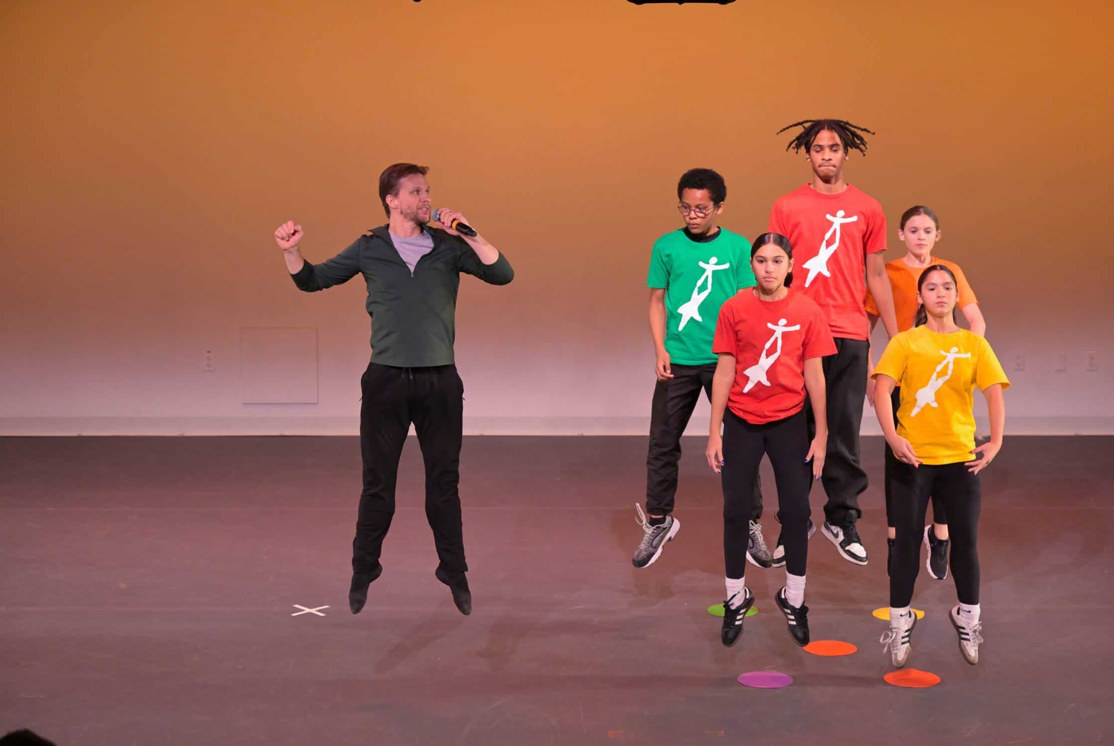 Energetic dance performance by diverse youth at National Dance Institute showcase.